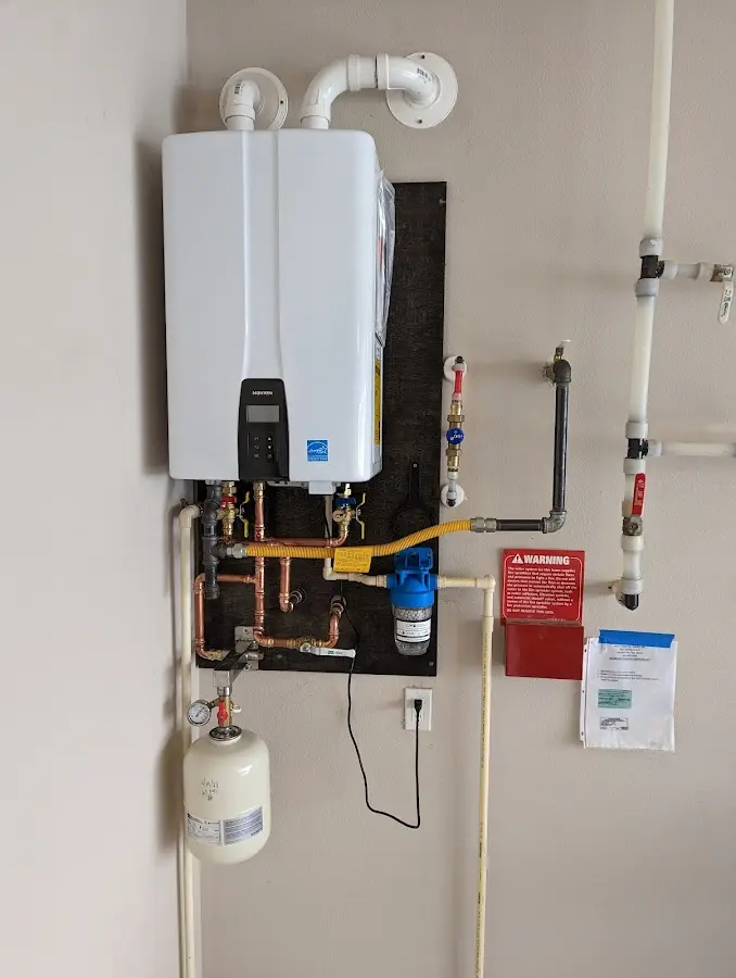 Professional plumber installing copper piping in a Temple Terrace home